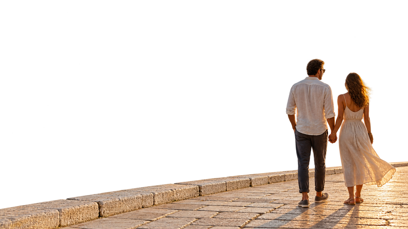 A couple enjoying the coast at sunset
