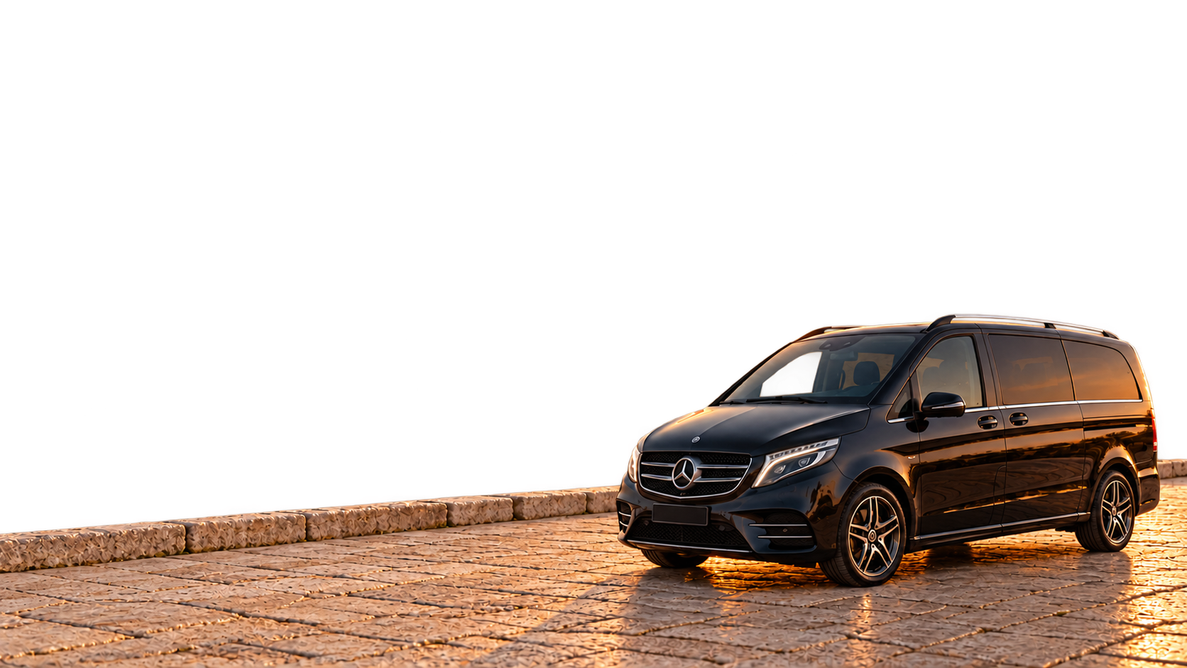 Illustrative black Mercedes V-Class on a stone quay at sunset